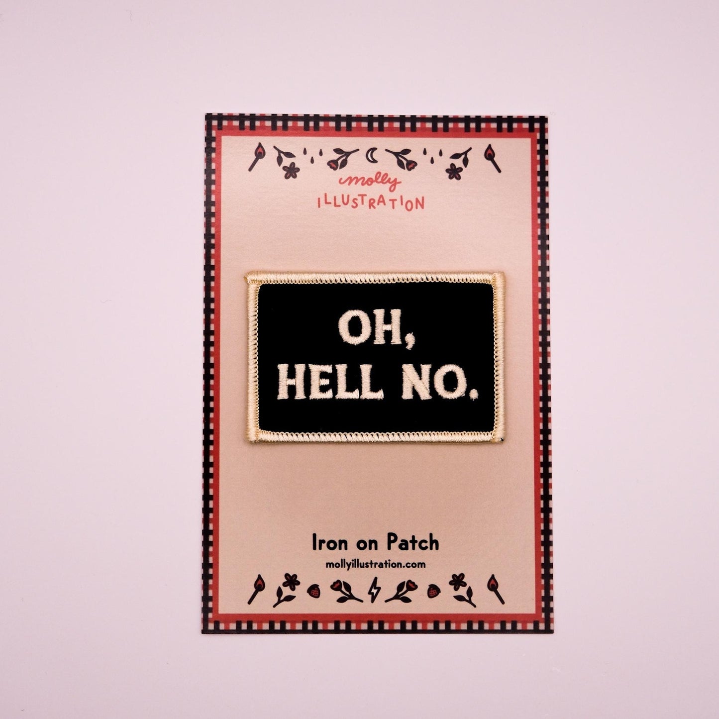 a black rectangular embroidered iron on patch that reads "Oh,Hello No." in off white lettering packaged on a Molly Illustration backer card