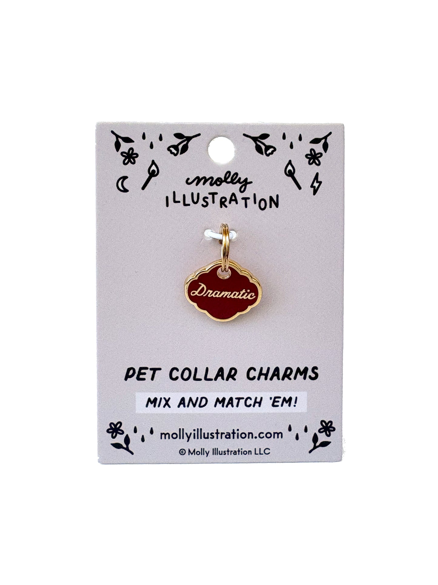 Pet collar charm that reads "dramatic" on a Molly Illustration branded card with decorative elements.