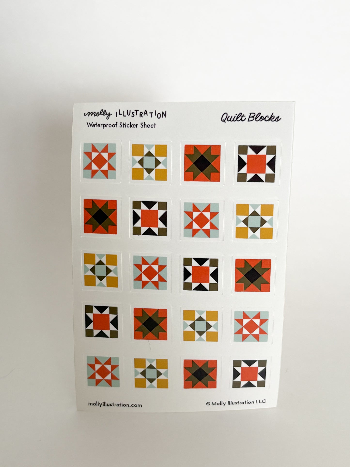 Sheet of quilt block stickers with various geometric patterns on a white background