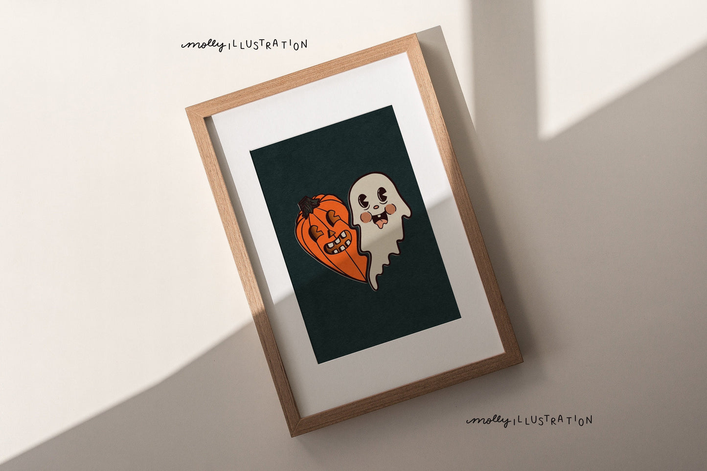 An illustrated art print of a cartoon heart that is half jack o’ lantern and Half ghost over a dark green background.