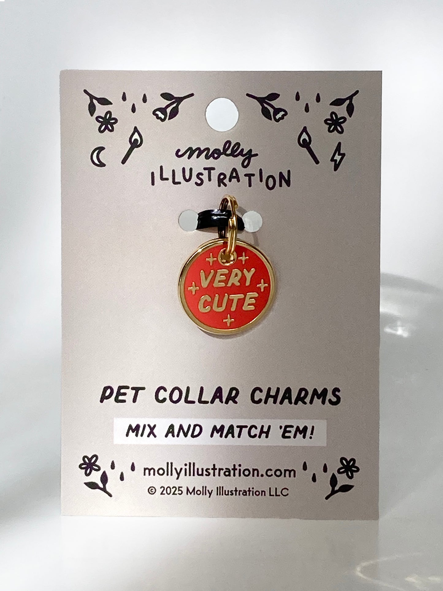 A hard enamel pet collar charm that reads “Very Cute”