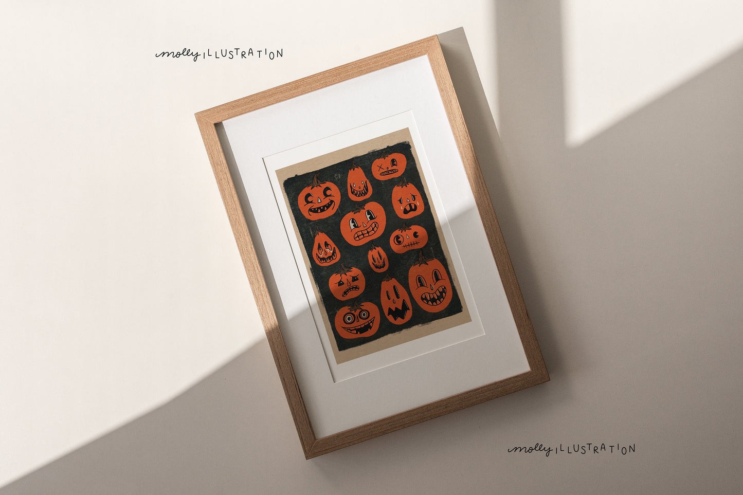 an illustrated art print of vintage inspired jack o lantern illustrations. there are twelve orange pumpkins over a dark grey black background