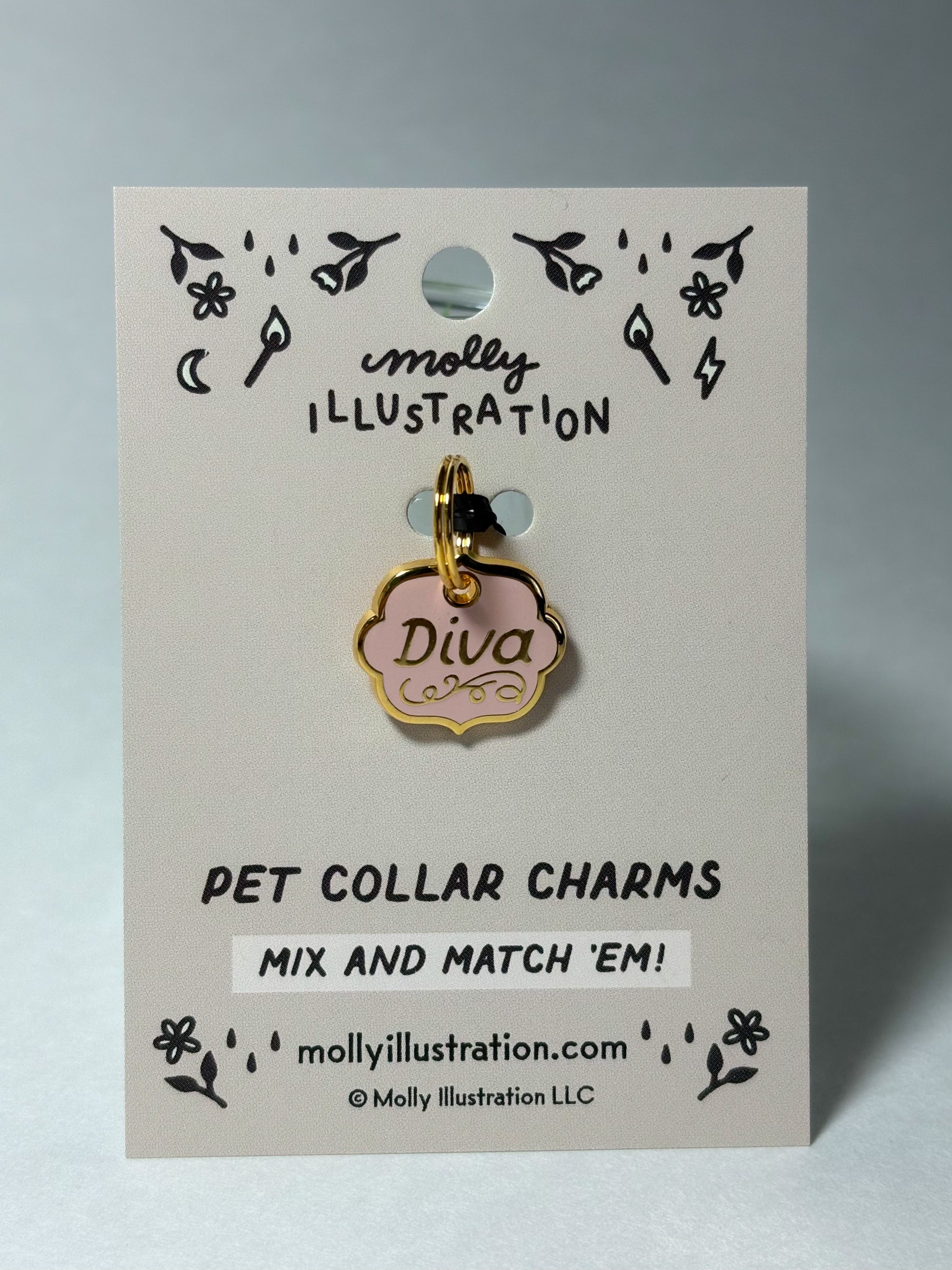 Pink and gold colored pet collar charm that reads "Diva" on a Molly Illustration backer card.