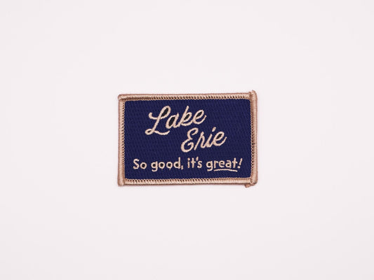 a blue rectangular embroidered iron on patch that reads "Lake Erie, So good, it's great!" in off white lettering.