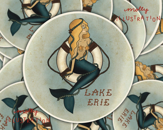 an illustrated waterproof vinyl sticker that shows a pin up girl mermaid that reads "Lake Erie."