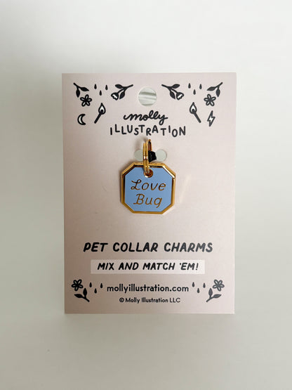 Pet collar charm with 'Love Bug' on a Molly Illustration branded card.