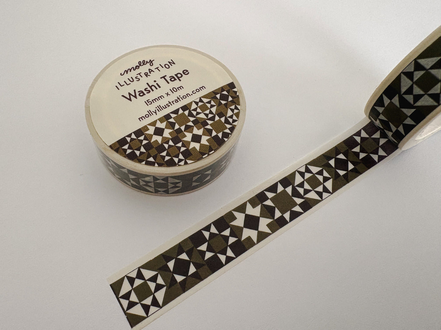 Olive and black quilted washi tape on a white background