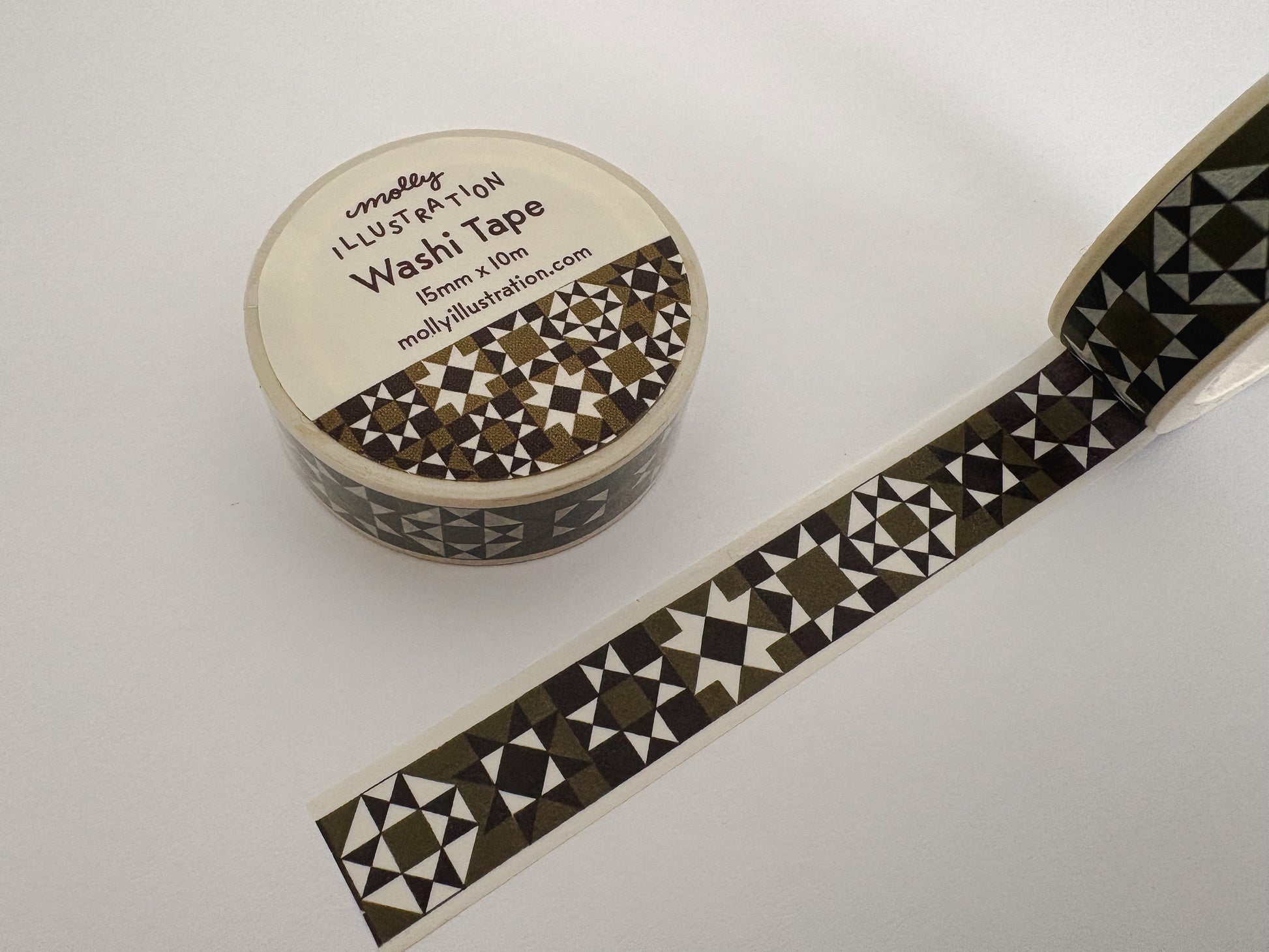 Olive and black quilted washi tape on a white background
