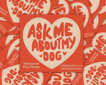 A kiss cut waterproof vinyl sticker in the shape of a heart that reads “ask me about my dog.”