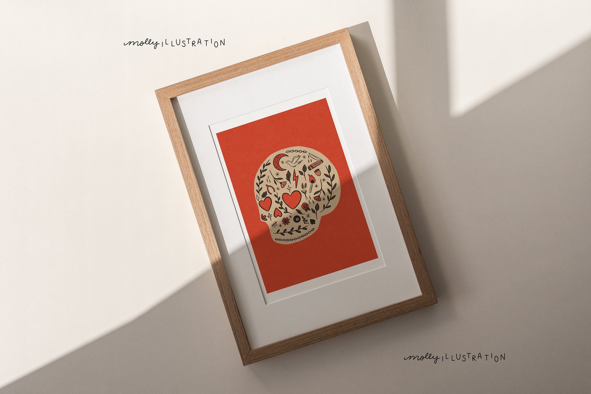 an illustrated art print of a cartoon skull filled with decorative motifs over a red background.