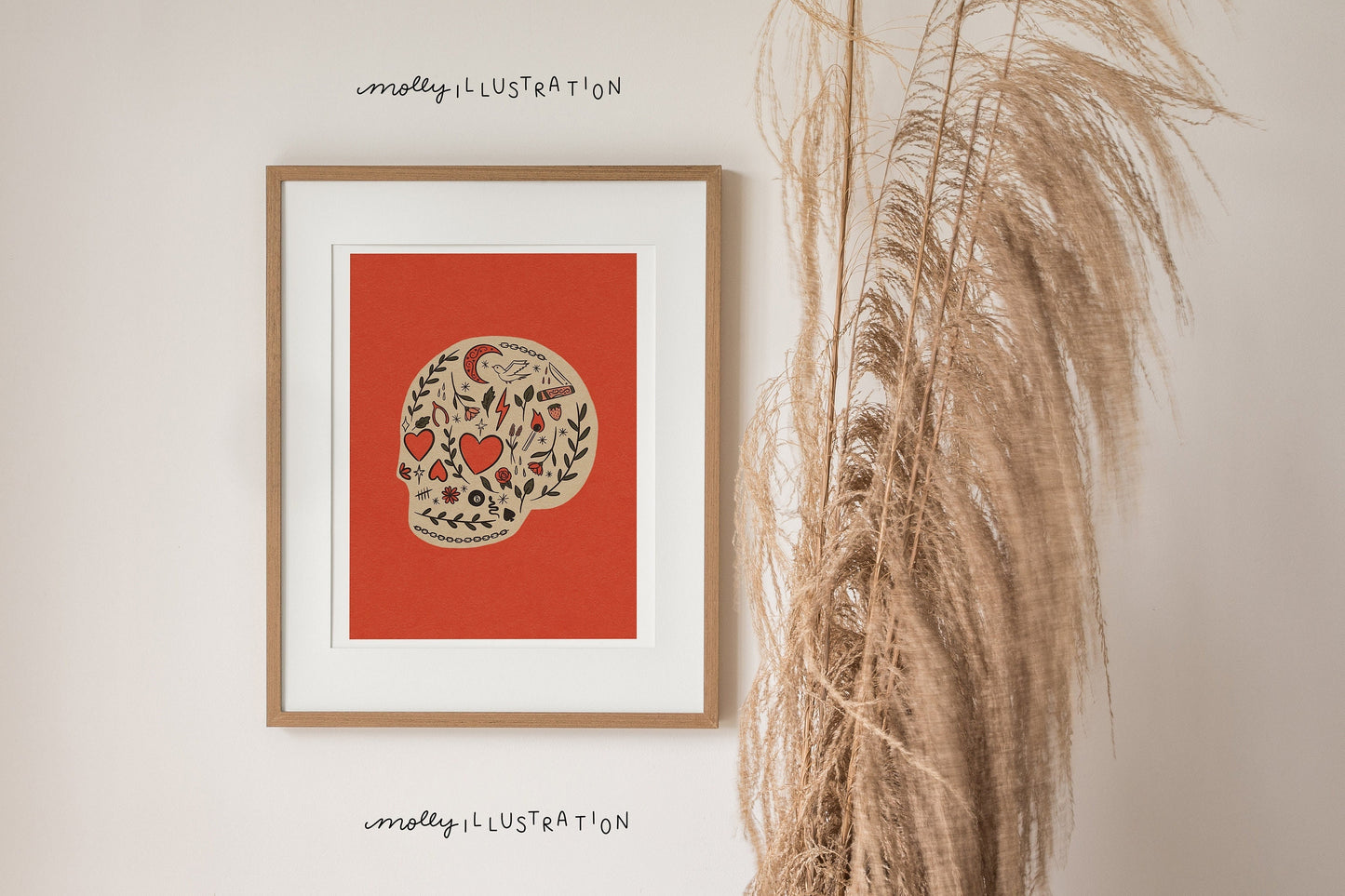 an illustrated art print of a cartoon skull filled with decorative motifs over a red background.