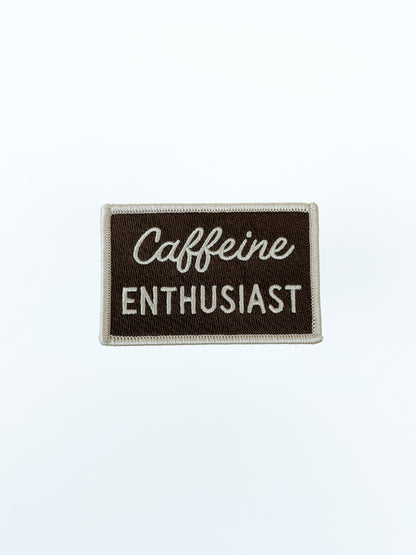 Patch with 'Caffeine Enthusiast' text on a brown background