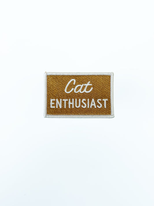 Patch with 'Cat Enthusiast' text on a white background
