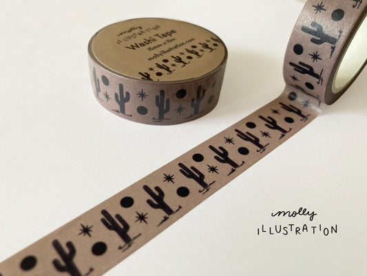 A roll of illustrated washi tape printed with cacti and a moon, sun  and stars.