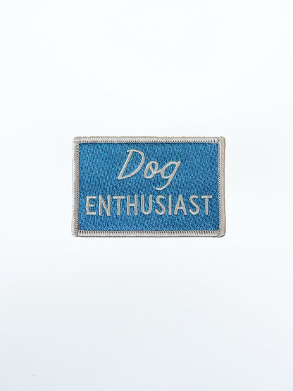 Embroidered patch with 'Dog Enthusiast' text on a blue background