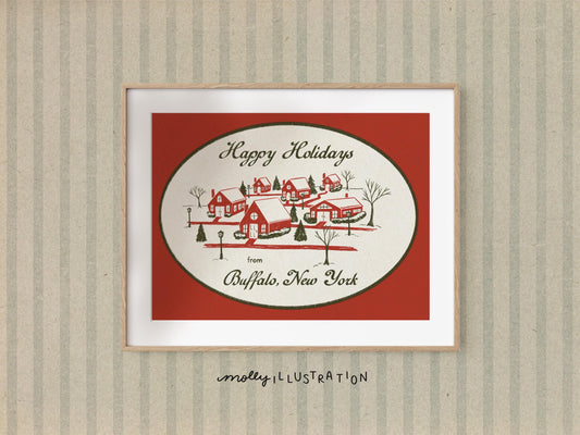 an illustrated art print that reads "Happy Holidays from Buffalo New York!" surrounding a red and green illustration of a snowy village.