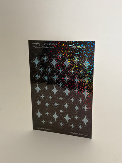 Sheet of star-patterned holographic stickers on a white background