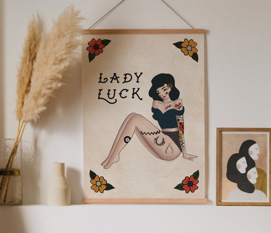 an illustrated vertical art print of a tattooed pin up girl with flowers that reads "Lady Luck"