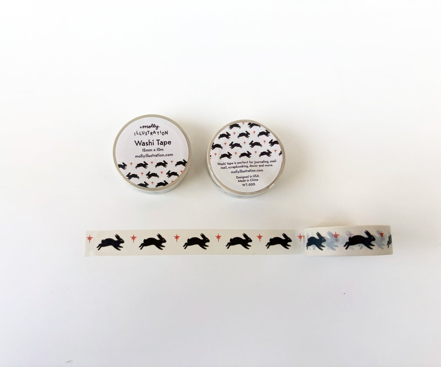 Two rolls of washi tape with rabbit designs on a white background