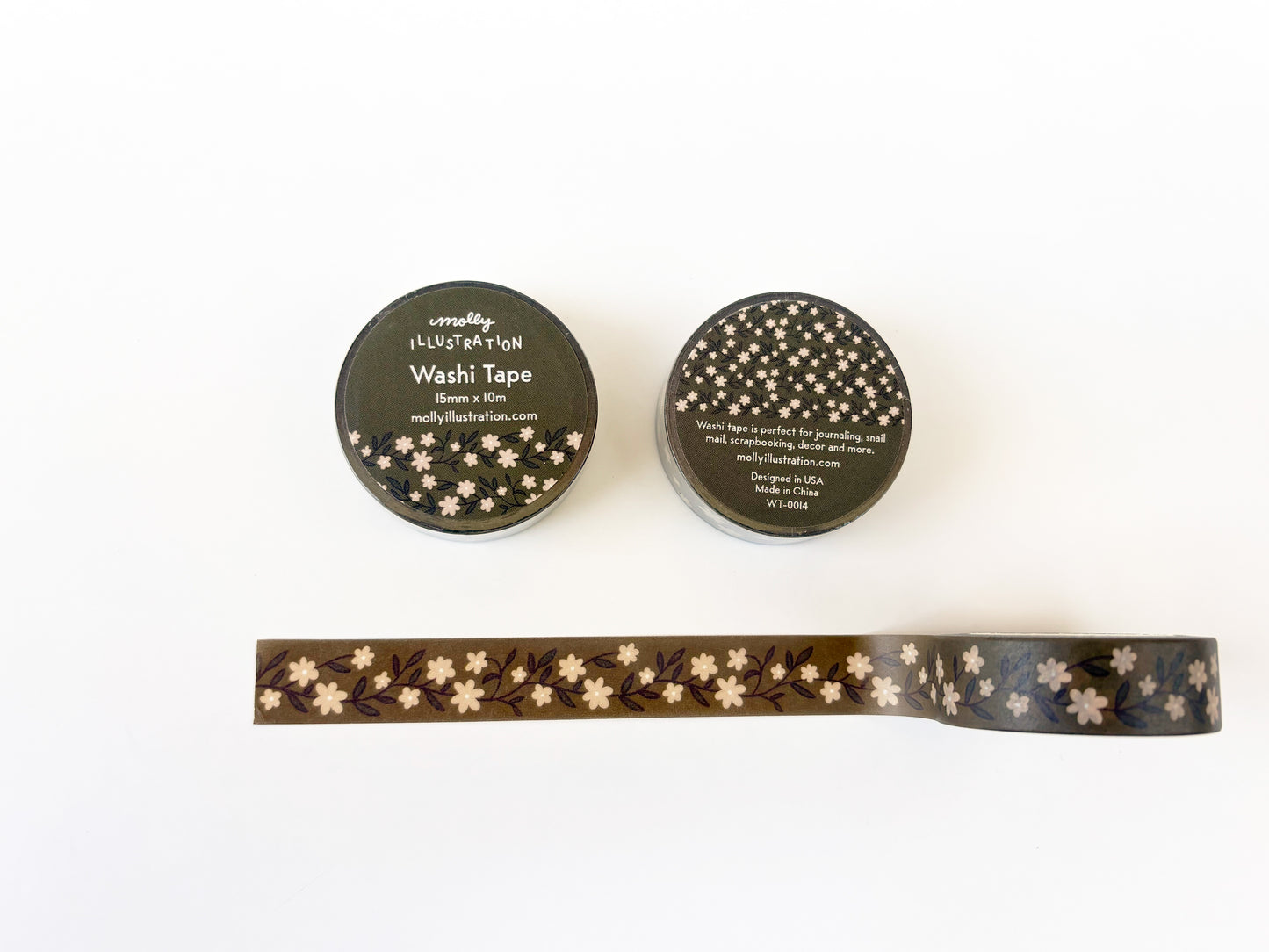 Two rolls of washi tape with a floral pattern on a white background