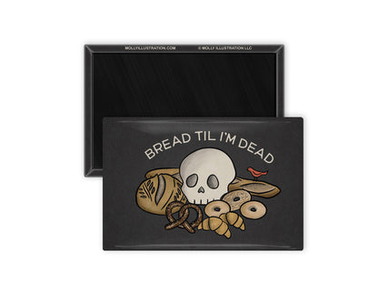 a rectangular refrigerator magnet showing the front and back. the front is dark grey and has a cartoon of a skull on a pile of various breads and reads "Bread Til I'm Dead" above the drawing